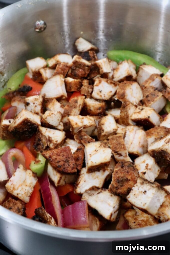 Golden Grilled Chicken Quesadillas 6 diced grilled chicken with sliced onions and bell peppers in a pot