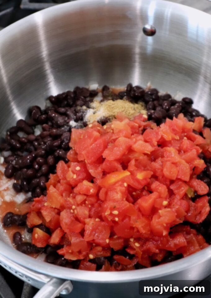 Traditional Mexican Black Beans 4 black beans in pot with diced tomatoes