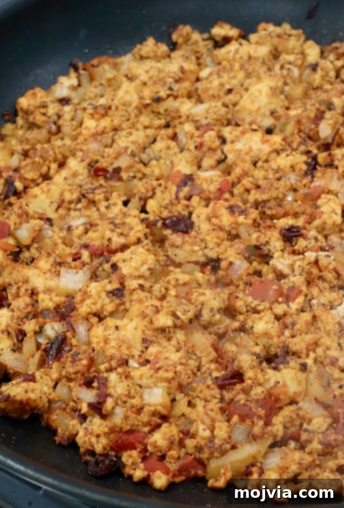 seasoned, cooked, crumbled tofu in a skillet