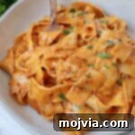 Calabrian Fire Pasta 11 pasta tossed with creamy nduja sauce in bowl with fork
