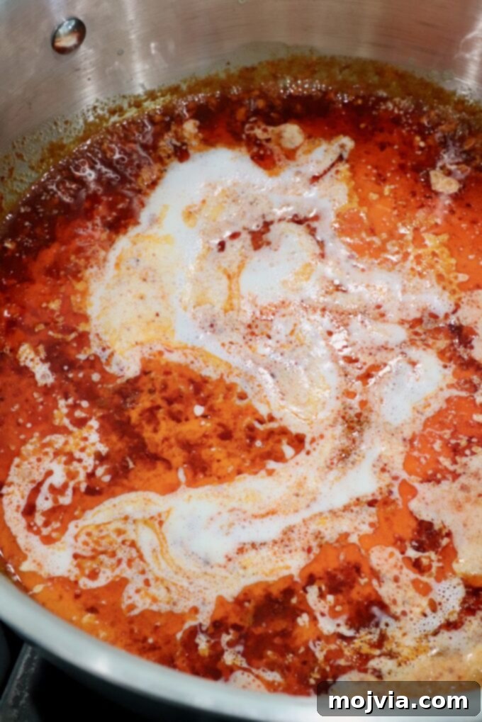 Calabrian Fire Pasta 6 heavy cream in nduja sauce in a pan