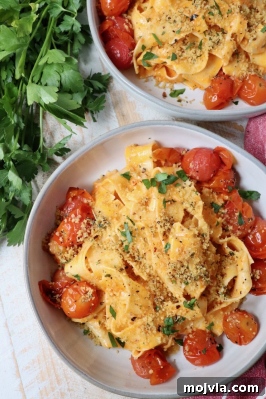 Calabrian Fire Pasta 9 nduja pasta in bowl with roasted cherry tomatoes and toasted breadcrumbs