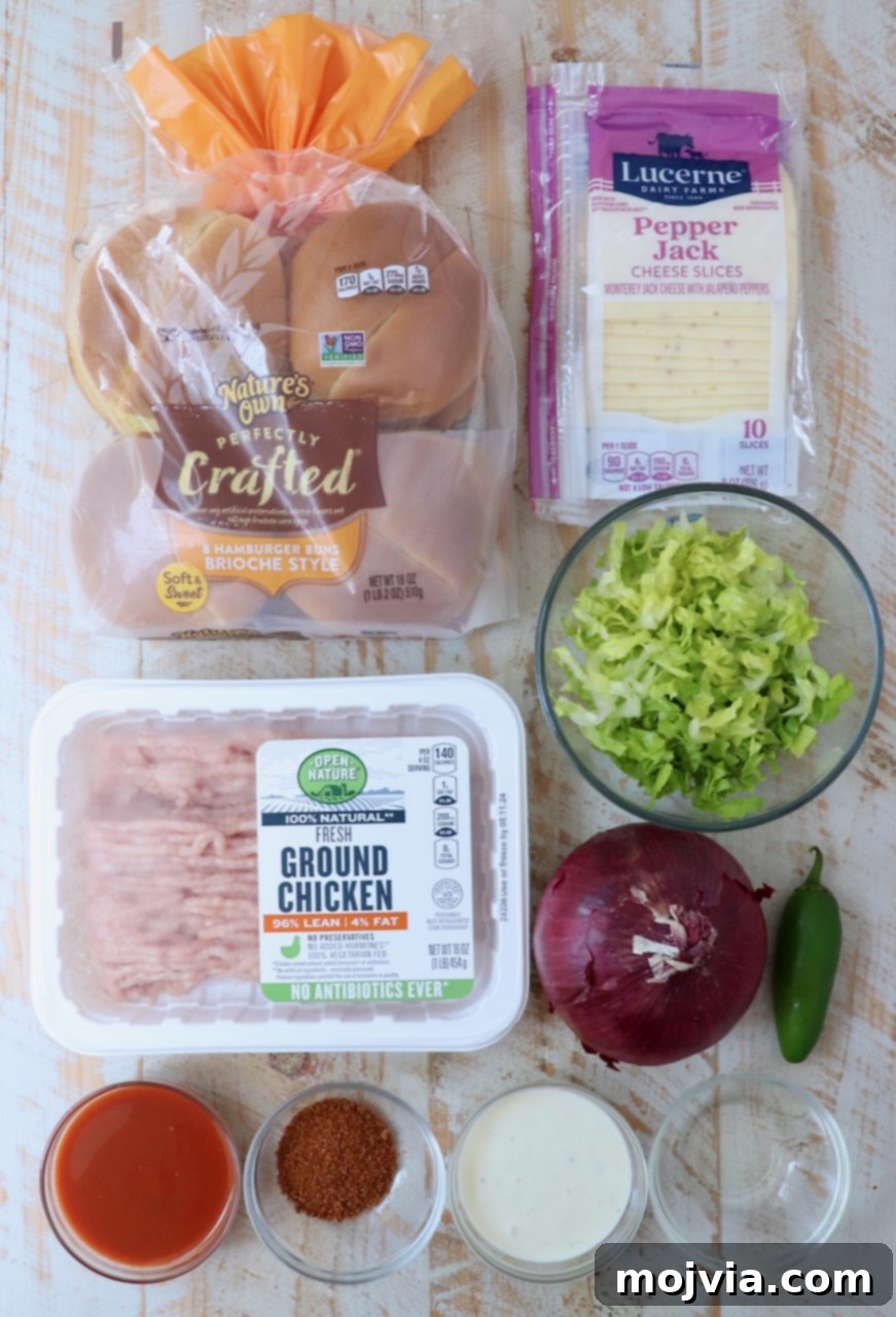 Spicy Buffalo Chicken Smash Burger 3 ingredients for buffalo chicken smash burgers on a white wood board