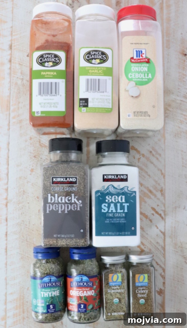 Ultimate Beef Stew Spice Mix 3 dried herbs and spices in containers on a white wood board