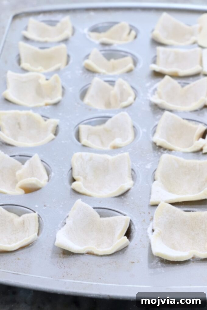 Dill Pickle Pastry Poppers 4 puff pastry dough in a mini muffin tin