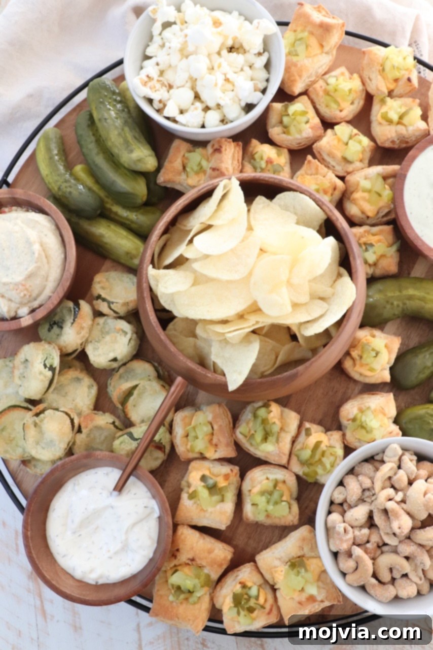 A vibrant assortment of pickles and snacks artistically arranged on a large, inviting wooden board, ready for sharing at a gathering.