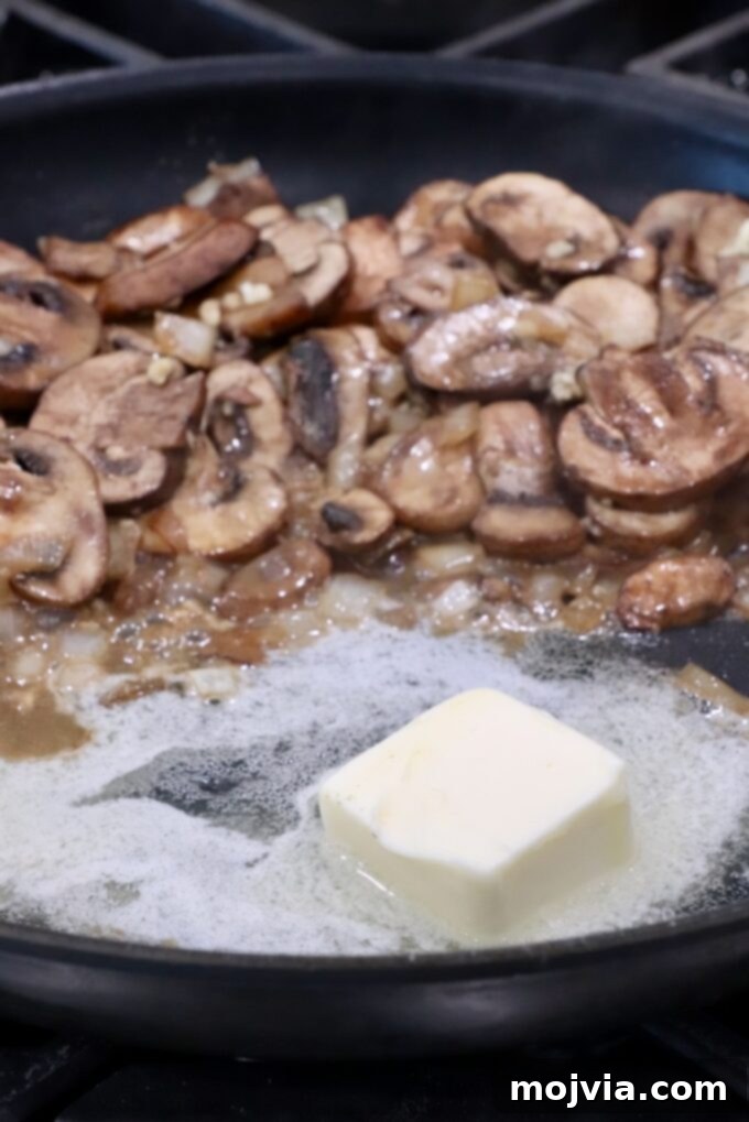 Wild Mushroom Gravy 6 Melted butter being incorporated into the mushrooms and aromatics, preparing for the roux.