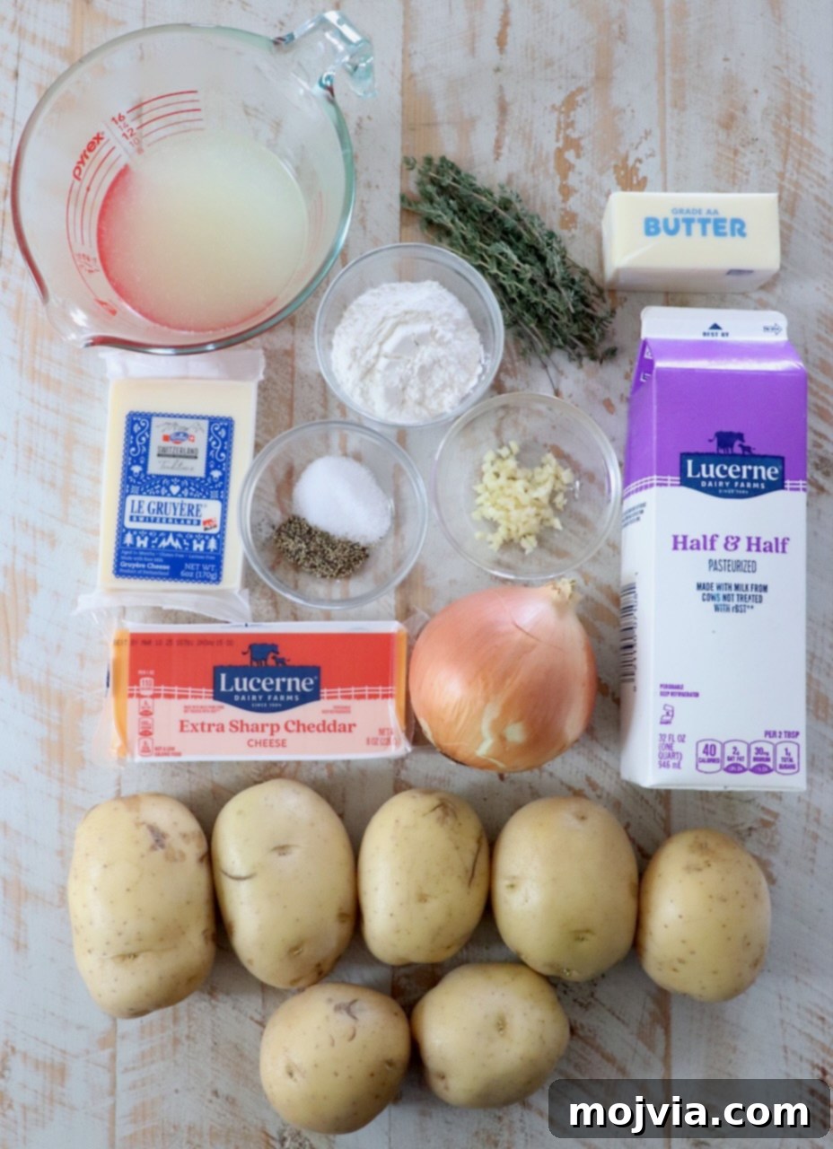 Ultimate Cheesy Potato Bake 3 ingredients for au grain potatoes on a white wood board