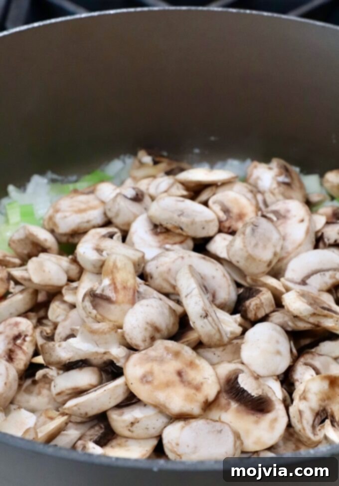 Umami Mushroom Stuffing 6 Sautéed onions and celery mixed with sliced mushrooms, cooking down in a large pot to tender perfection.