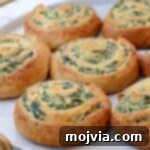 Spinach pinwheels on a plate, ready to be served