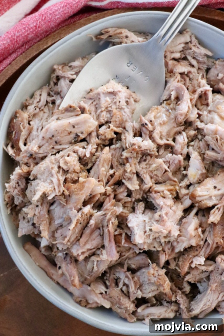 pulled pork in bowl with large serving fork