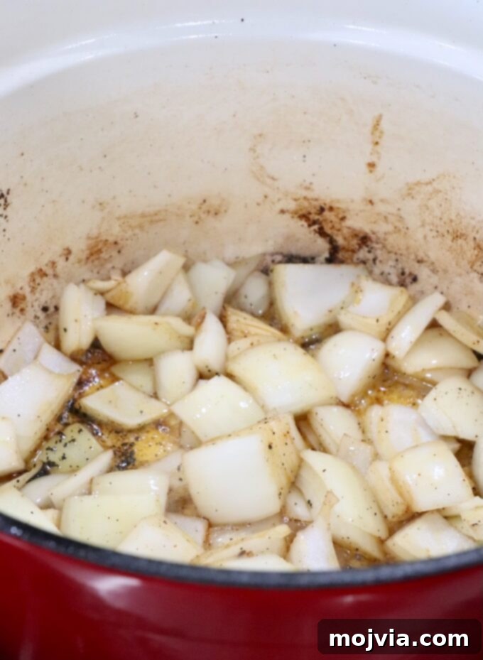 large diced onions in a large cast iron pot