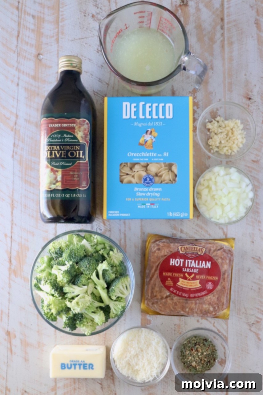 Savory Sausage and Broccoli Orecchiette 3 ingredients for orecchiette pasta recipe on a white wood board