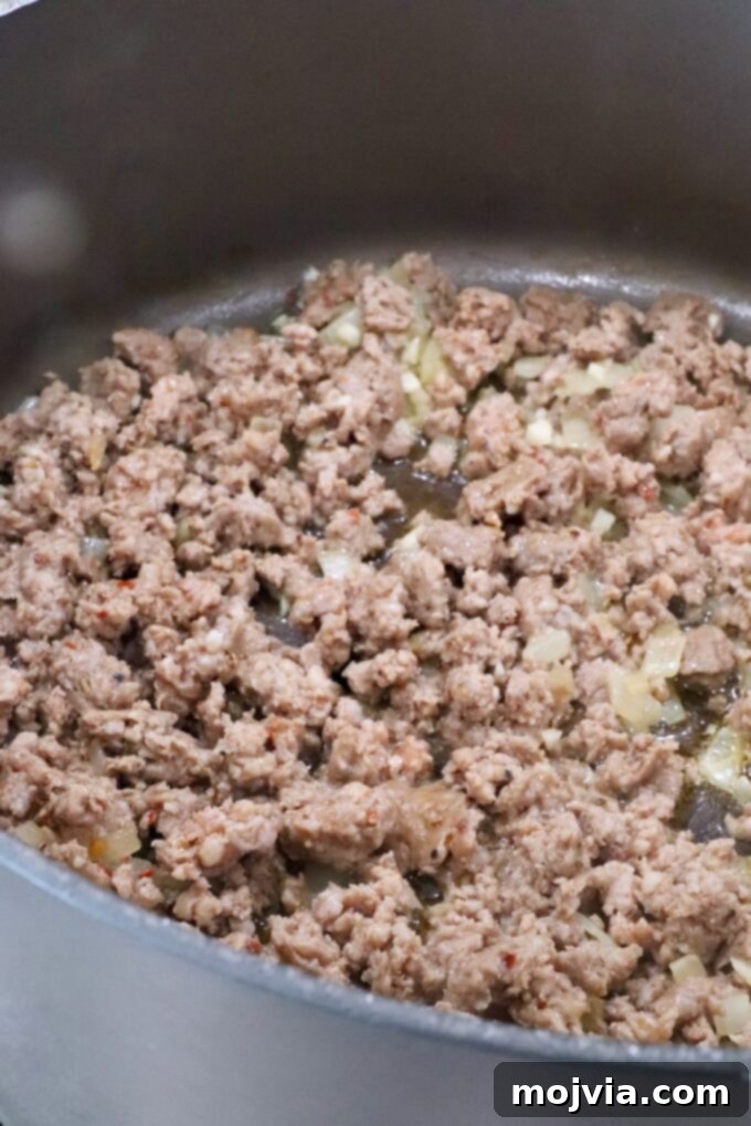 Savory Sausage and Broccoli Orecchiette 5 cooked sausage and onions in a large pot