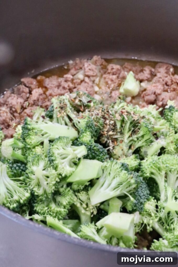 Savory Sausage and Broccoli Orecchiette 6 seasoned broccoli and cooked sausage in a large pot