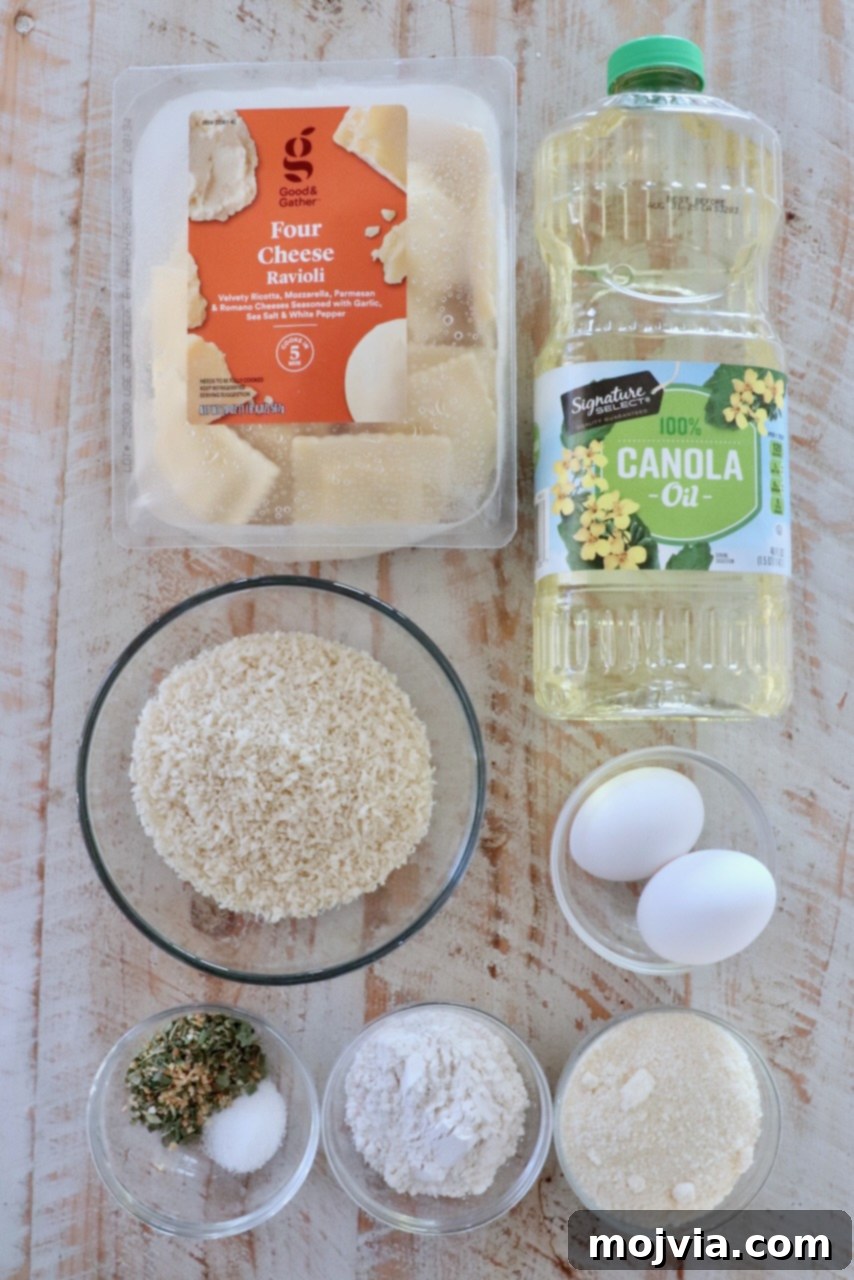 ingredients for toasted raviolis on a white wood board