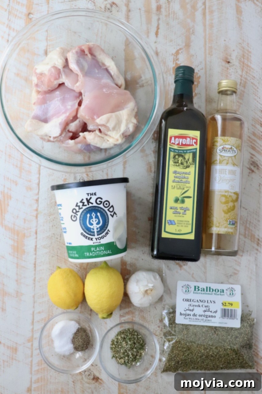 Greek Style Chicken Gyros 3 ingredients for chicken gyro meat on a white wood board