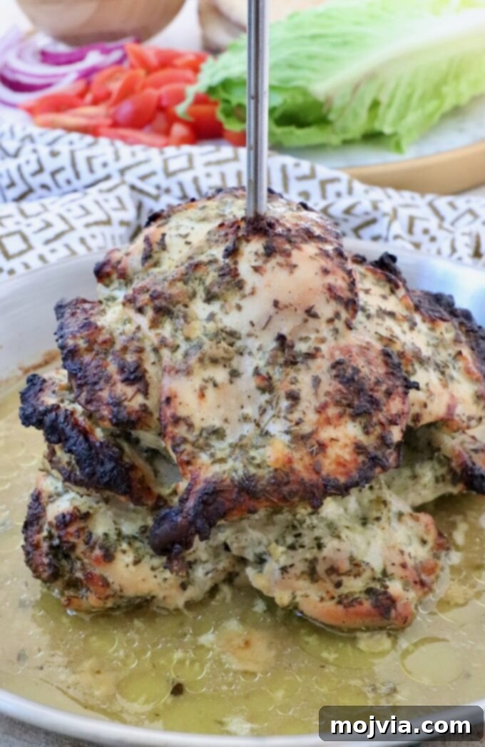 Greek Style Chicken Gyros 6 cooked chicken thighs on a vertical rotisserie