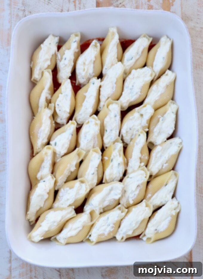 Cheesy Baked Stuffed Shells 7 cheese stuffed pasta shells in a casserole dish