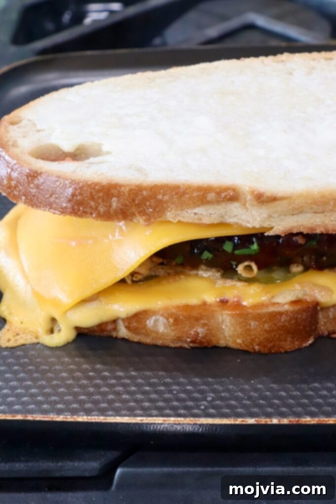 meatloaf sandwich on a griddle pan on the stove