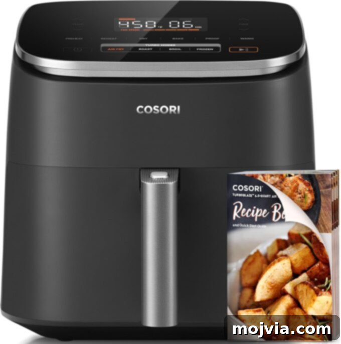 Sizzling Air Fryer Chicken Fajitas 8 A Cosori TurboBlaze 6-quart air fryer prominently displayed, with a recipe book leaning against it, suggesting ease of use for various recipes including air fryer chicken fajitas.