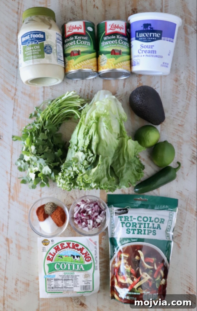 Esquites Style Corn Salad 3 ingredients for Mexican street corn salad on a white wood board