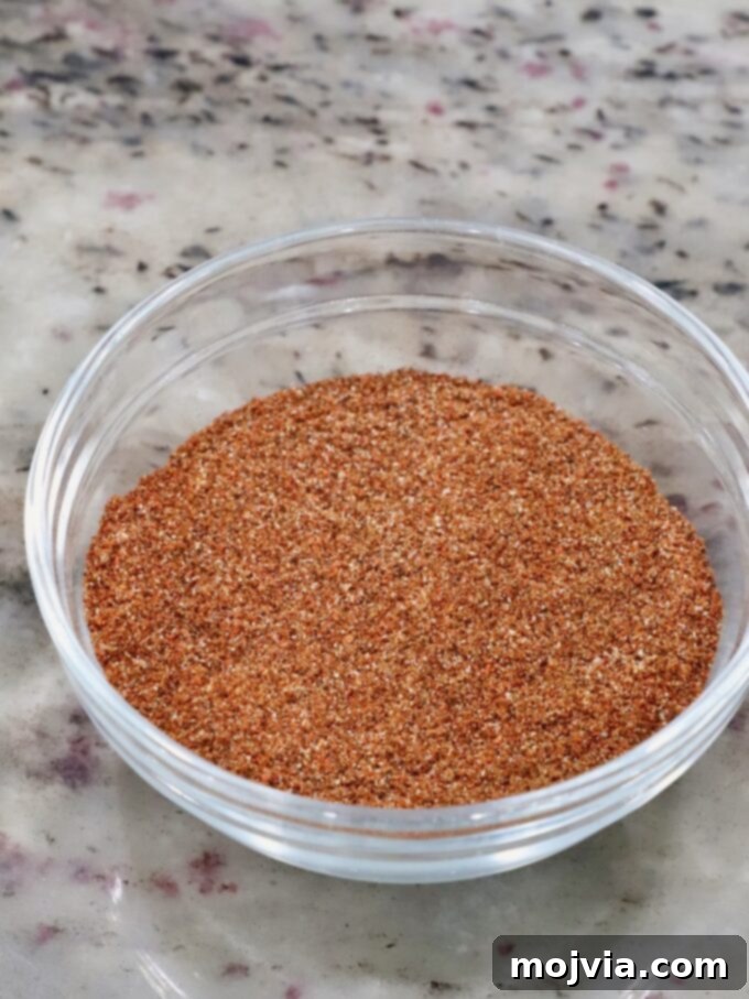 Chipotle Honey Glazed Chicken 4 seasoning mix in a small glass bowl, ready to be applied to chicken