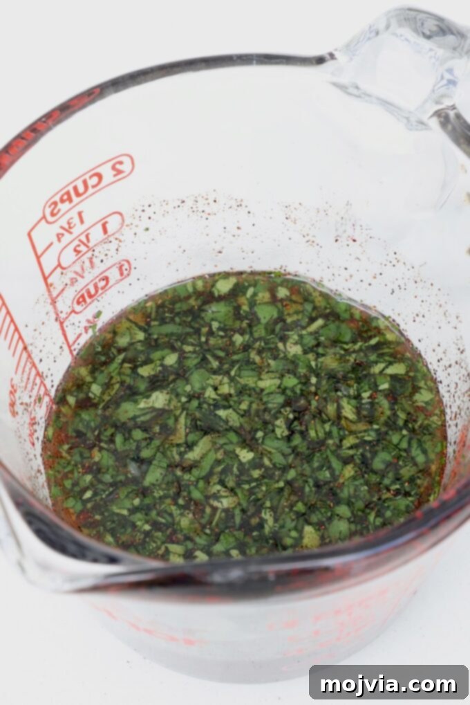 Chipotle Honey Glazed Chicken 5 cilantro, honey, lime juice, and chipotle chili powder mixed together in a glass measuring cup for the glaze