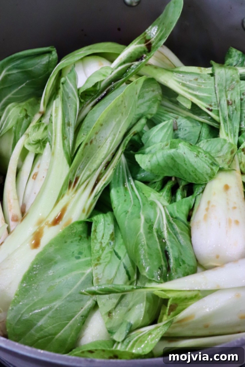Petite Bok Choy 4 baby bok choy cooking in a large pot