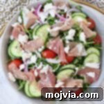 Refreshing Prosciutto Arugula Cucumber Salad 5 Prosciutto Salad with Cucumber and Arugula, garnished with feta cheese