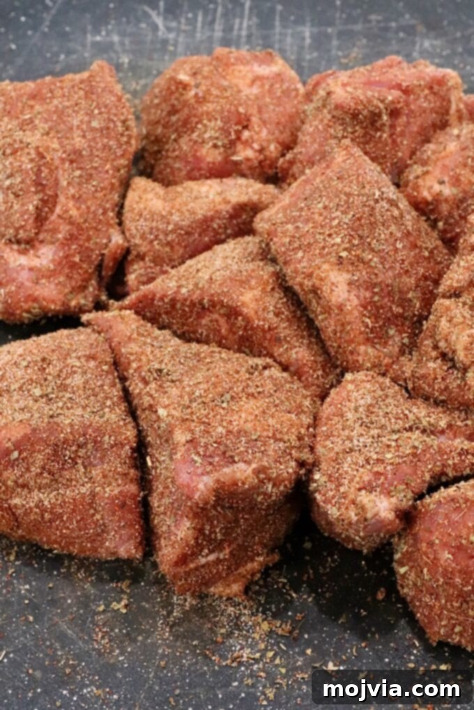 Pork Carnitas 3 seasoned chunks of pork on a cutting board