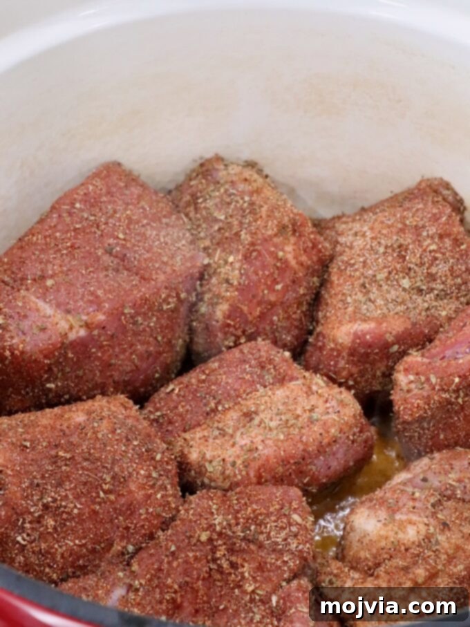 Pork Carnitas 4 seasoned pieces of pork in a large cast iron dutch oven