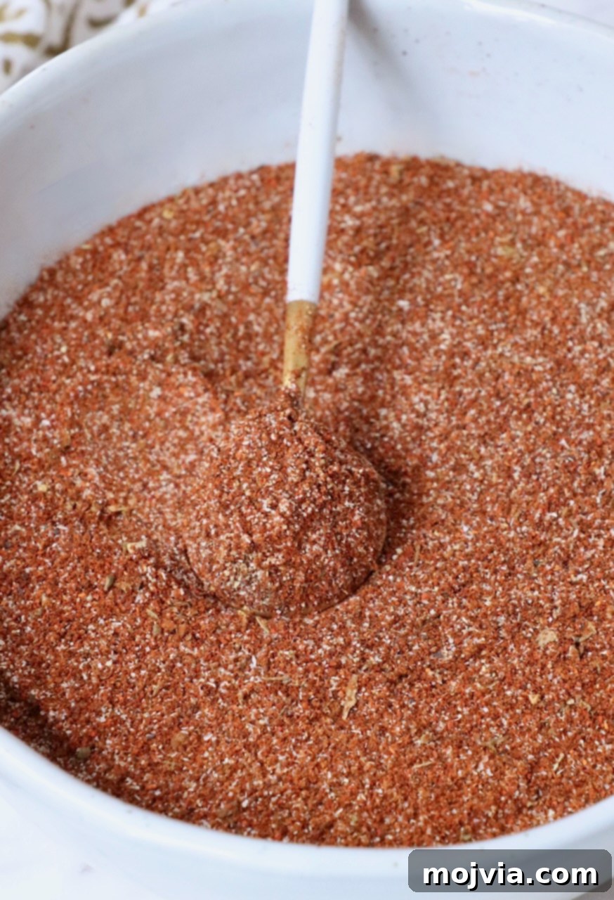 Ultimate Birria Flavor Mix 6 birria seasoning in a bowl with a spoon