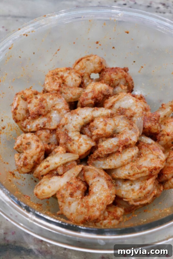 Sizzling Shrimp Fajita Feast 4 seasoned shrimp in a glass bowl