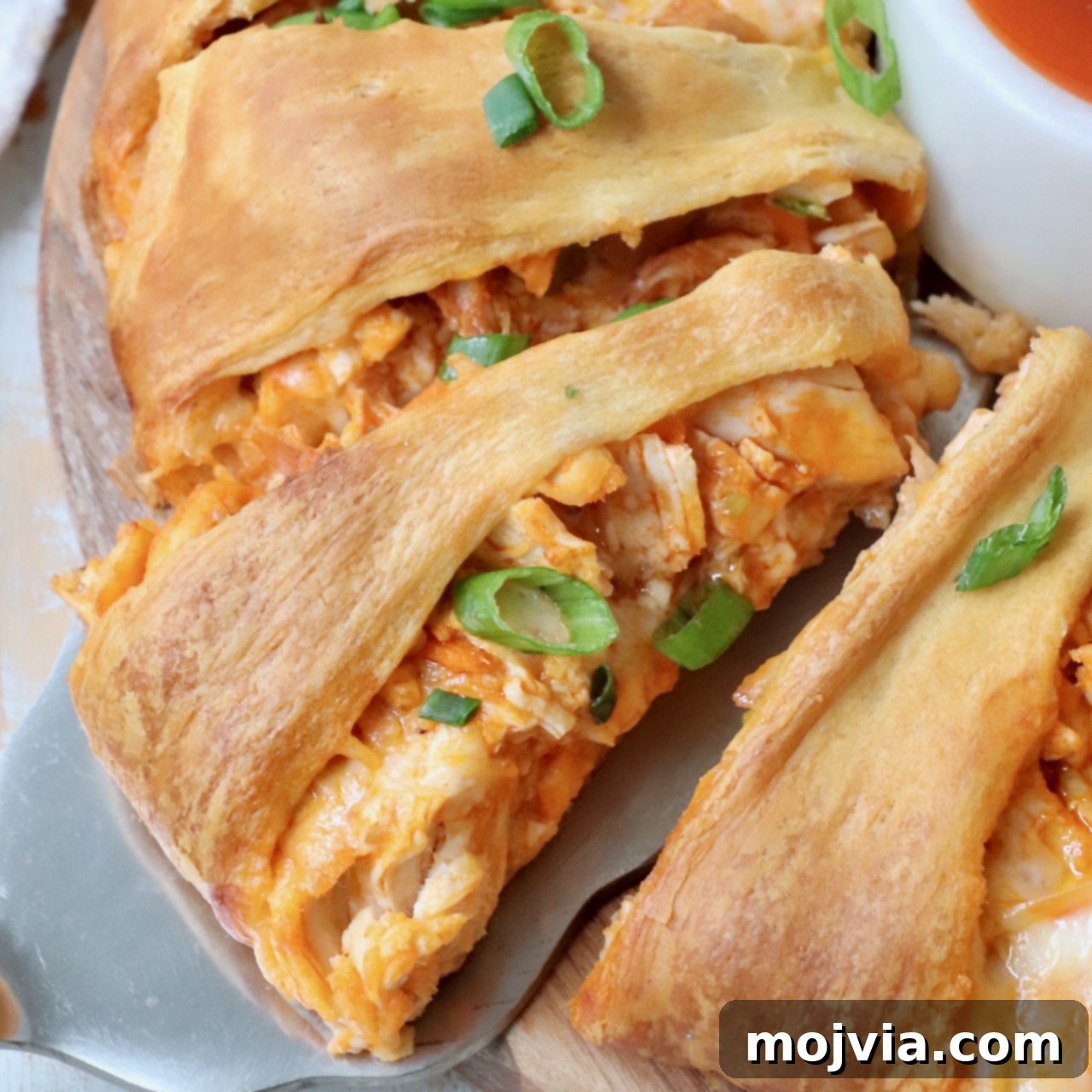 slice of buffalo chicken ring on a spatula