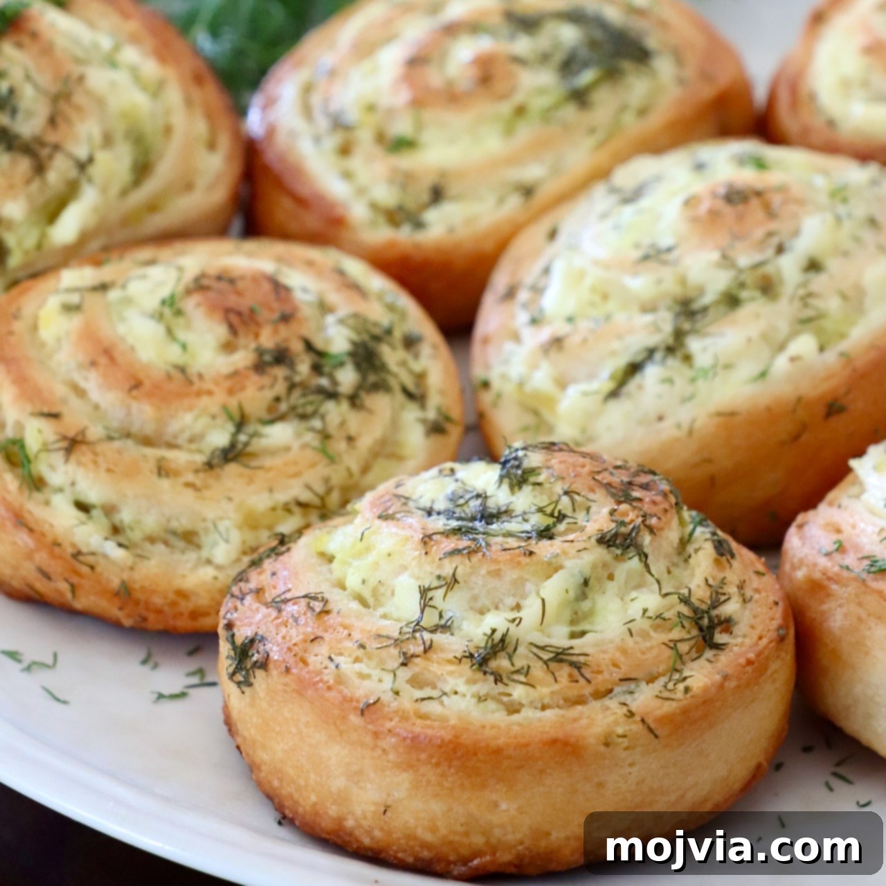 baked pickle rolls on a plate