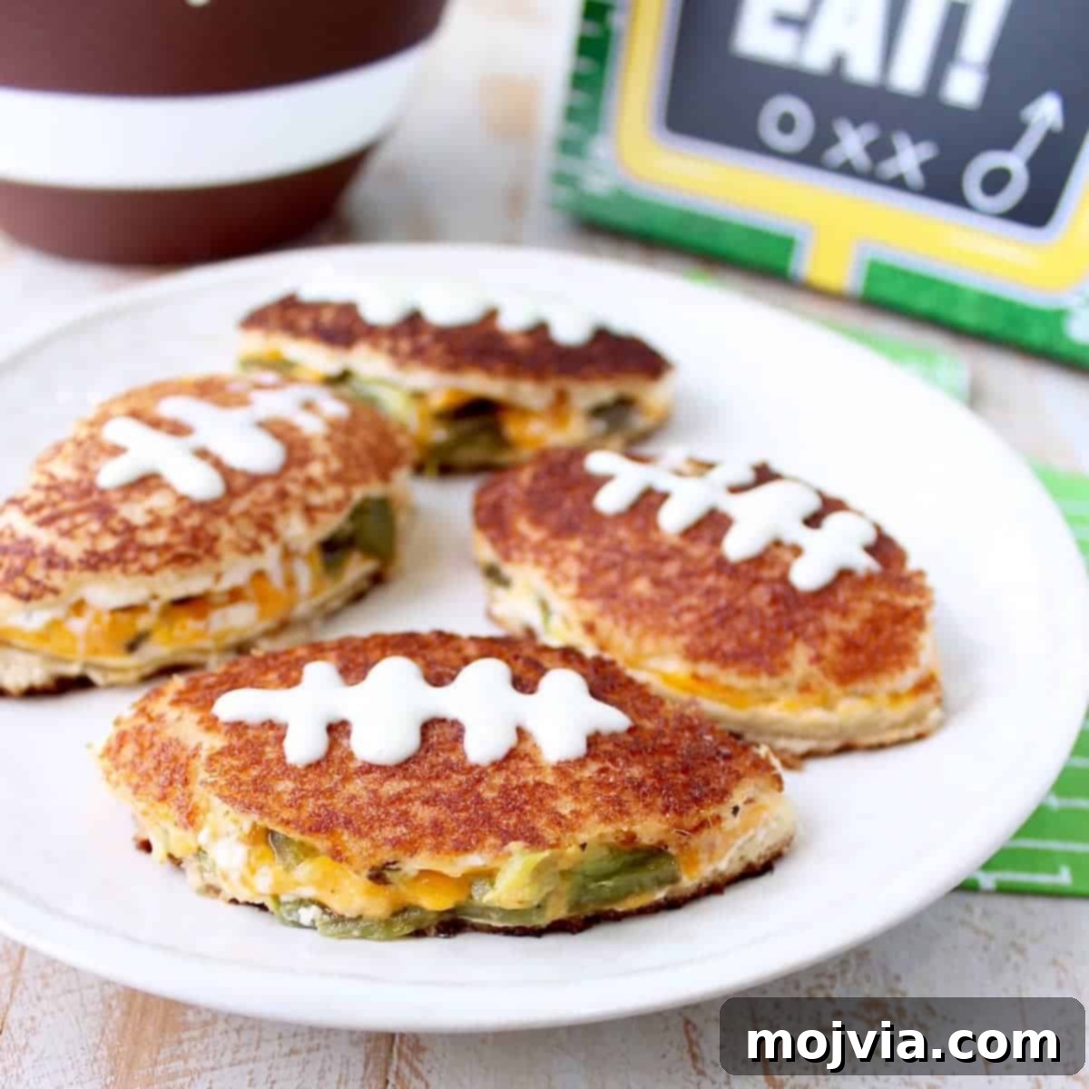 Jalapeno popper grilled cheese sandwiches in the shape of a football