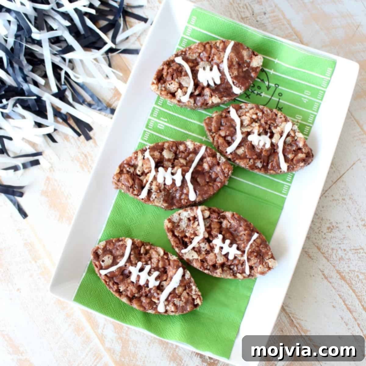 Nutella Rice Krispie Treats are a deliciously easy dessert, make them football shaped for game day parties or Superbowl Sunday!
