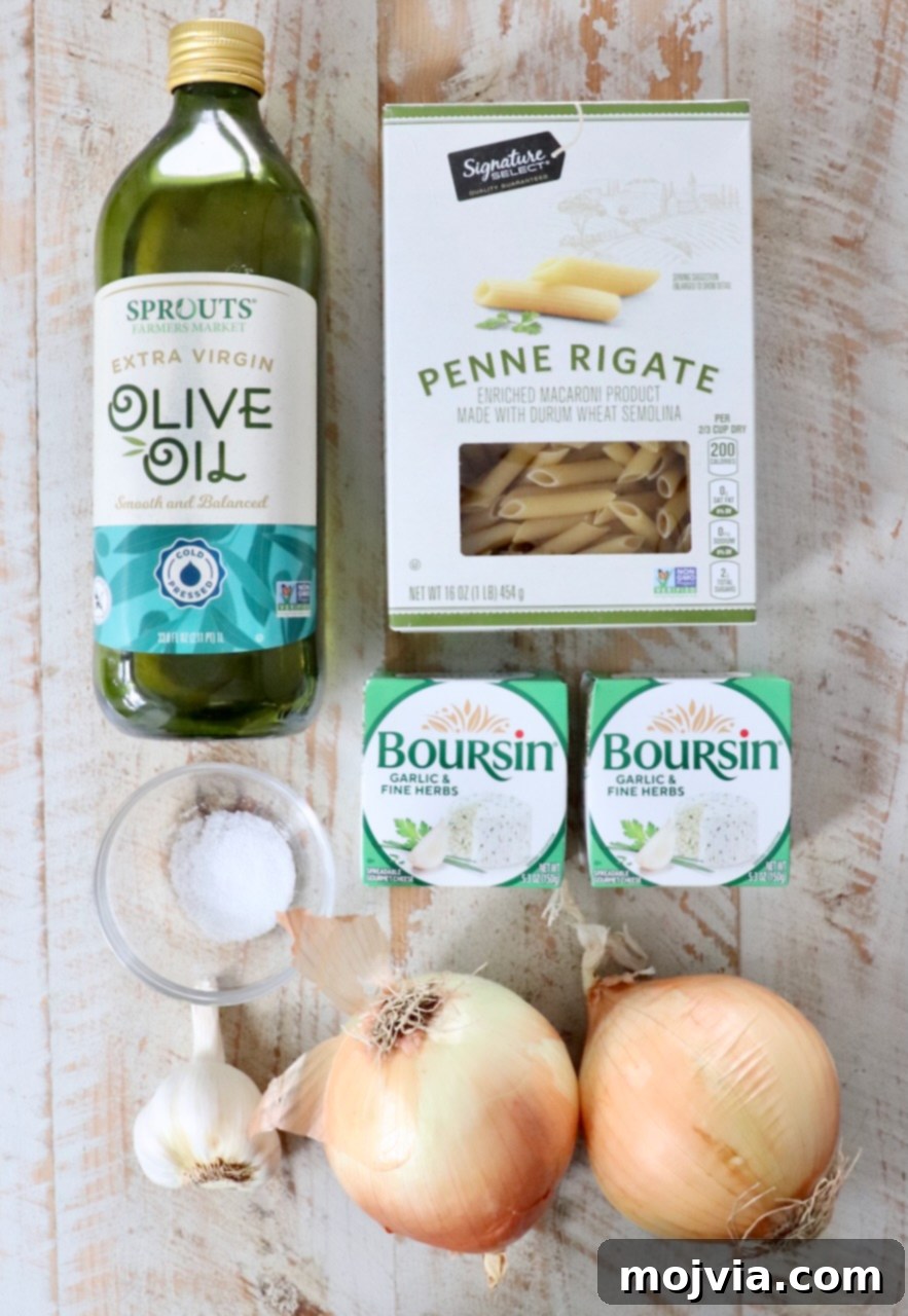 Golden French Onion Boursin Pasta 3 Ingredients on a wooden surface: olive oil, penne pasta, two packs of Boursin cheese, salt, garlic bulb, and two onions.