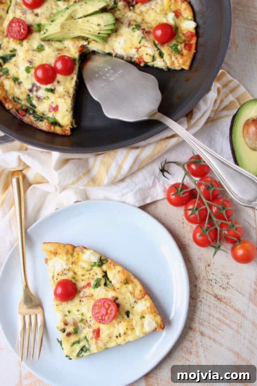 Savory Spinach and Bacon Frittata 3 Slice of frittata on plate, next to frittata in skillet