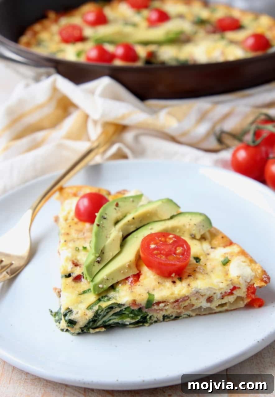 Savory Spinach and Bacon Frittata 5 Slice of frittata on plate with fork