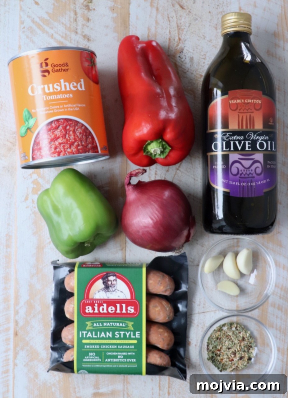 Classic Italian Sausage and Peppers 3 Fresh ingredients laid out for making Italian sausage and peppers: bell peppers, onions, garlic, Italian sausages, and a can of crushed tomatoes.