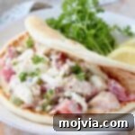 Zesty Greek Chicken Pita Pocket 5 chicken salad in pita bread on plate