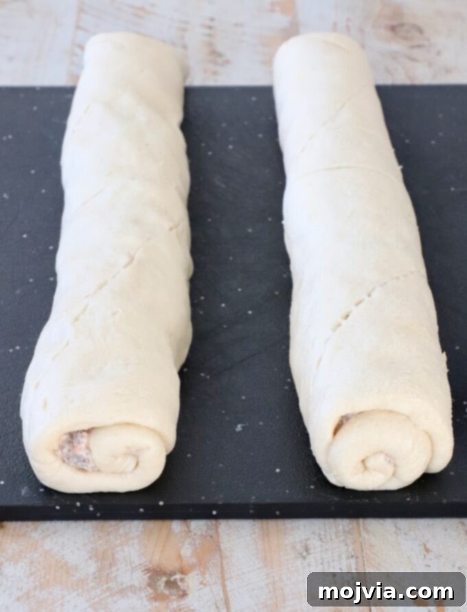Sausage Cream Cheese Crescents 7 Rolled up crescent roll dough