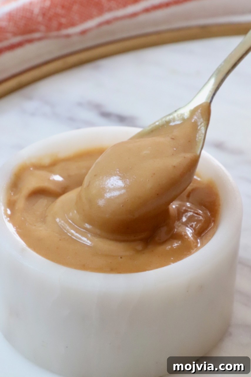 Thai Peanut Vinaigrette 2 Creamy peanut butter dressing in a white bowl