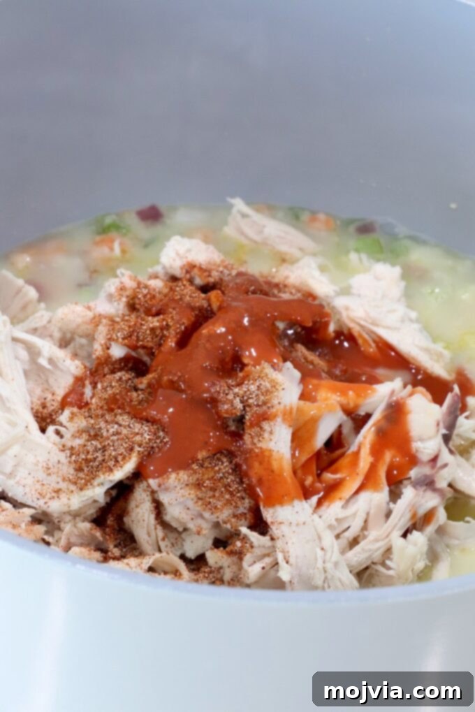 Buffalo Chicken Pot Pie
Savory Buffalo Chicken Pot Pie Delight 7 shredded chicken covered in seasonings and buffalo sauce in a pot with vegetables