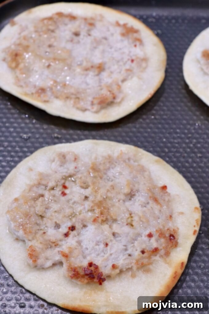 Cooking chicken tacos on a griddle