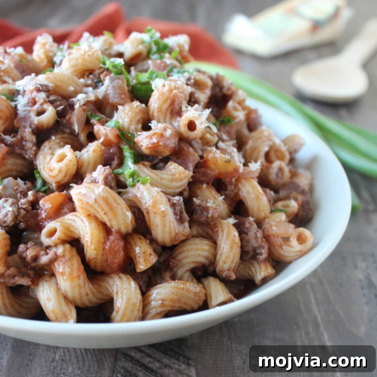 Large pot filled with pasta and meat sauce