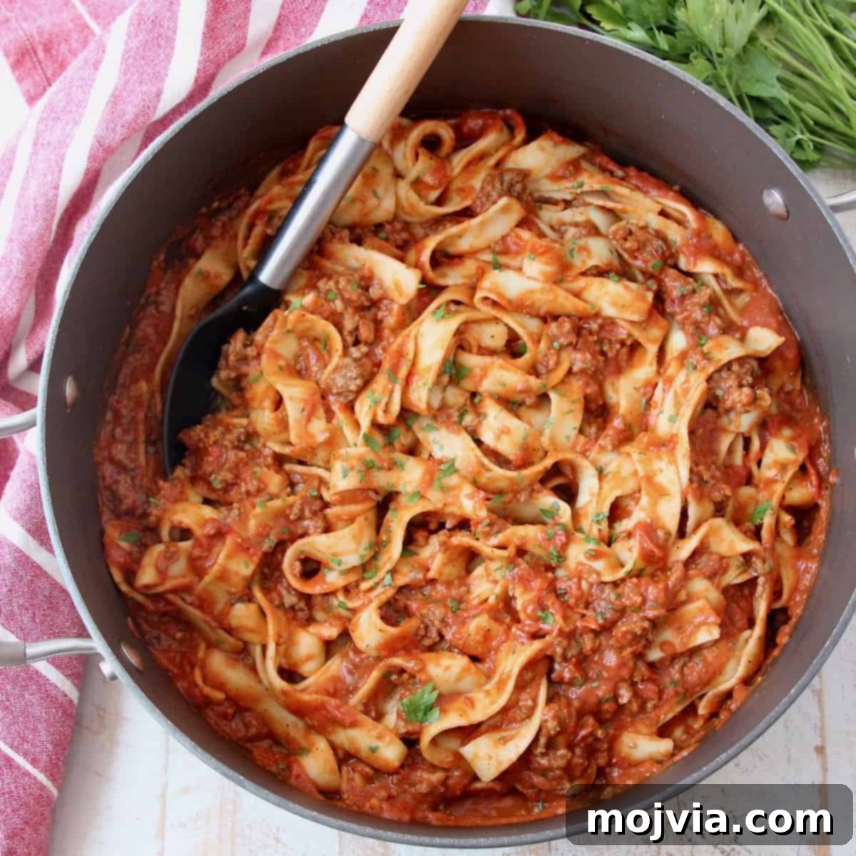 Large pot filled with pasta and meat sauce