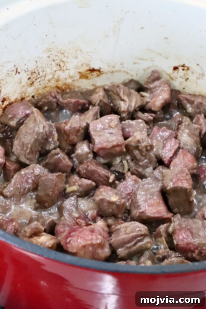 Caramelized Onion Beef Braise 6 seared pieces of beef in a large pot